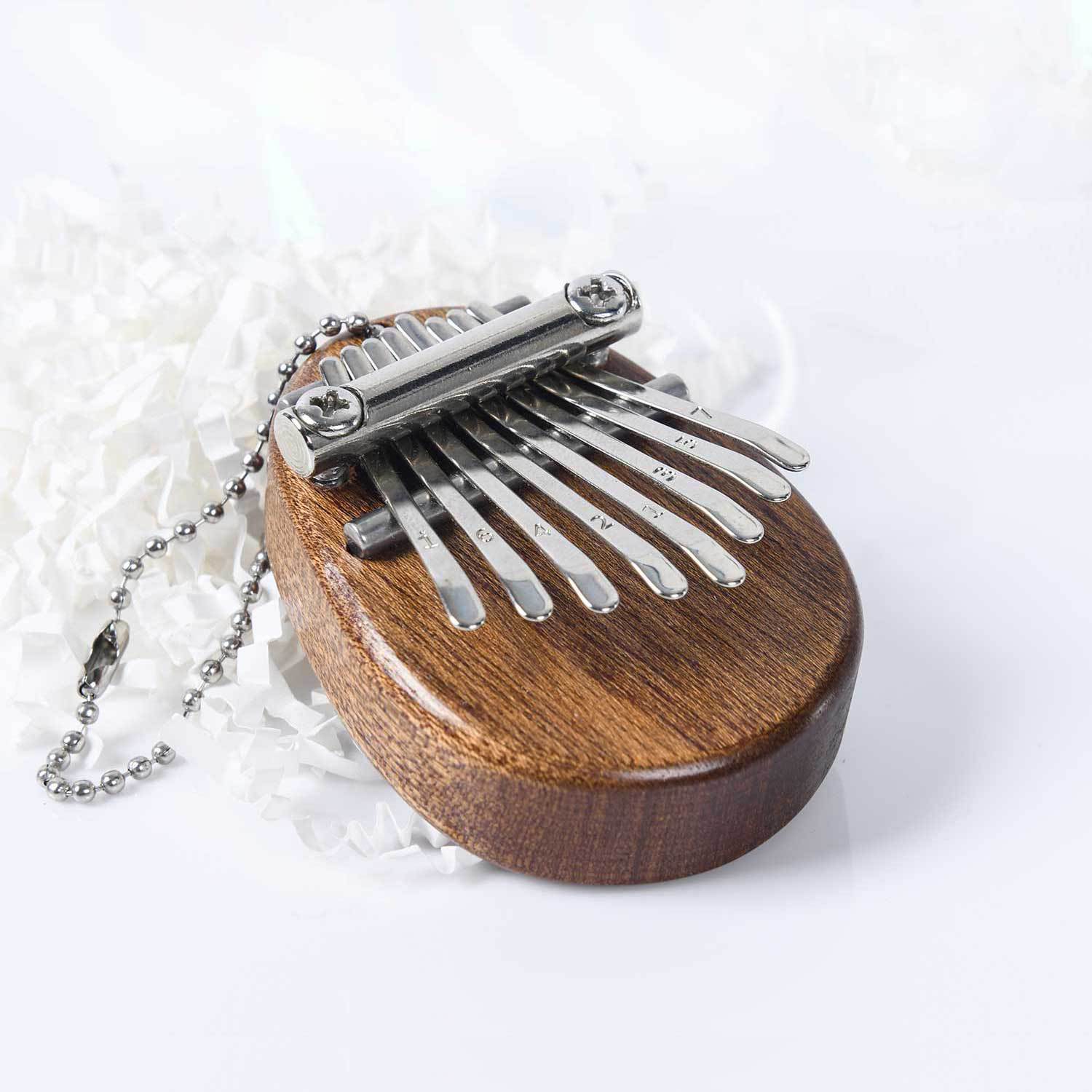 Solid wood thumb piano